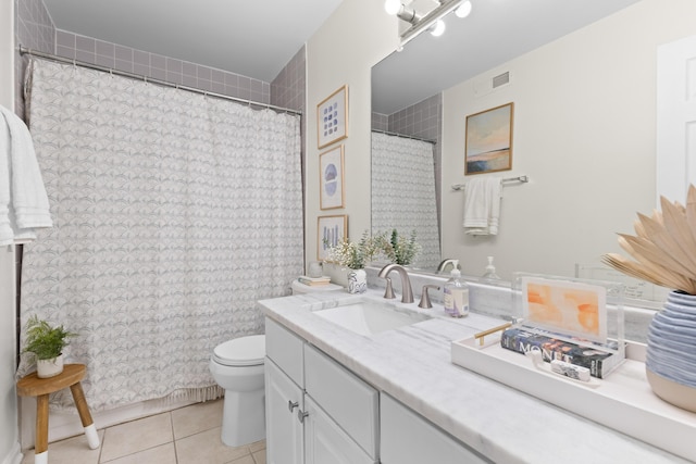 bathroom featuring tile patterned floors, toilet, and vanity