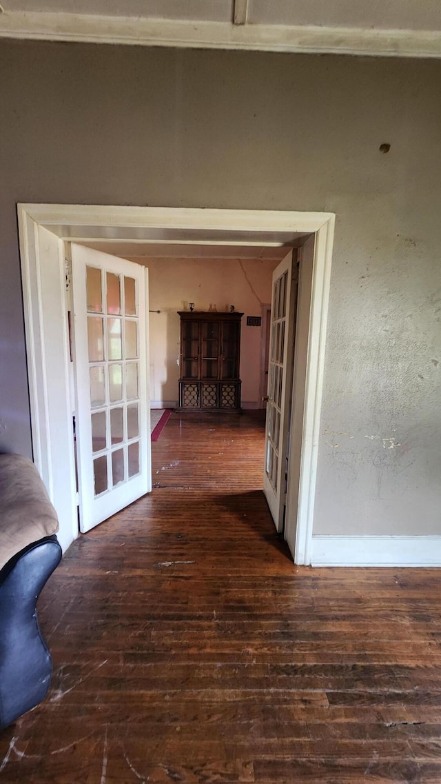 corridor with wood-type flooring