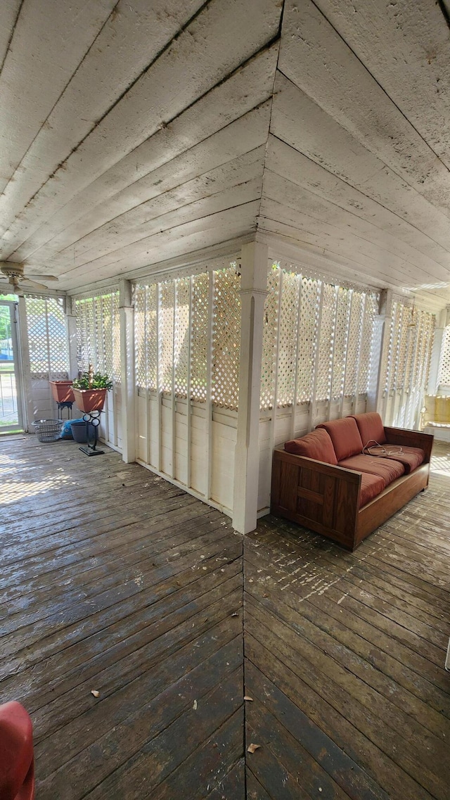 sunroom / solarium featuring hardwood / wood-style floors