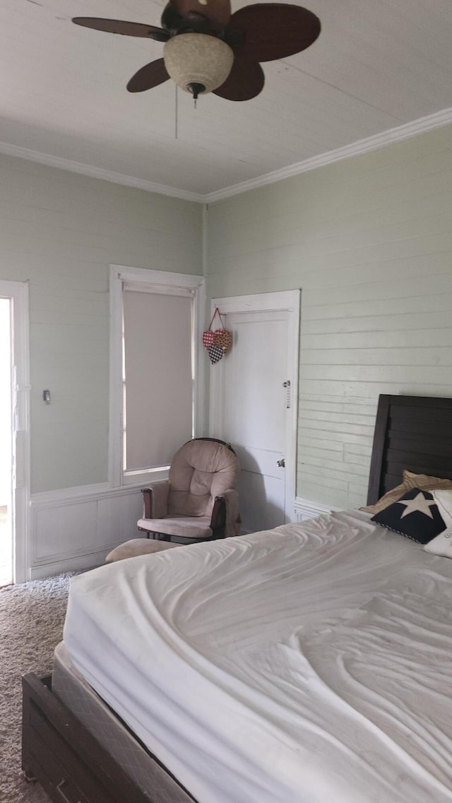 bedroom with ceiling fan and crown molding