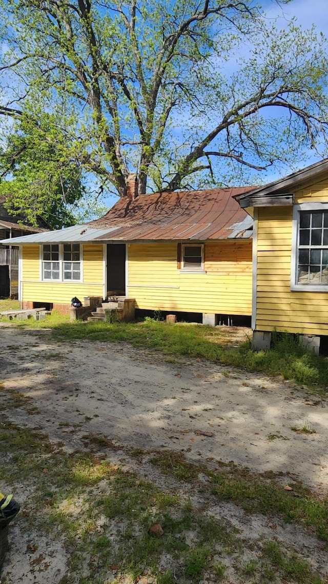 exterior space featuring a chimney