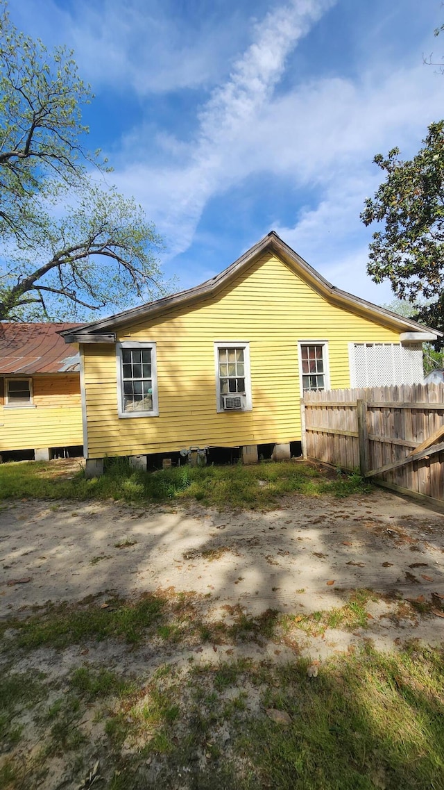 back of property with fence