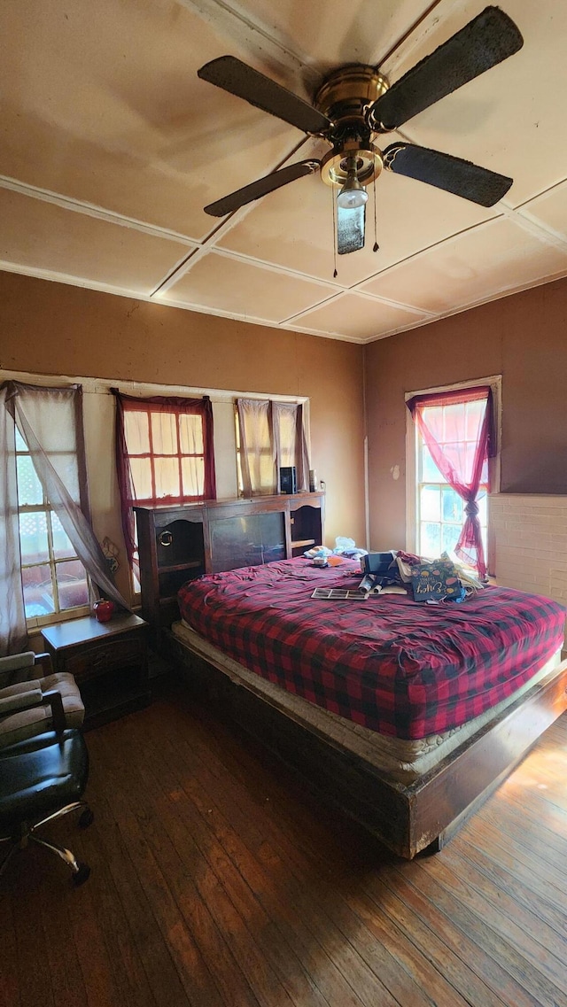 bedroom with hardwood / wood-style floors