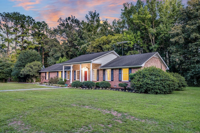 598 Maple Branch Rd, Reevesville, SC 29471 - ranch-style house with brick siding, a front lawn, and a shingled roof