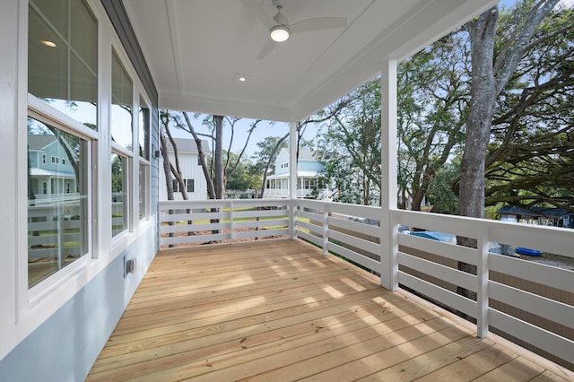 wooden deck featuring ceiling fan