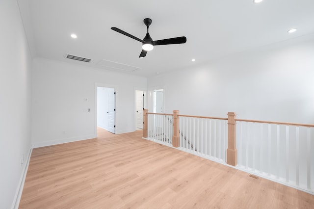 spare room featuring light wood-type flooring and ceiling fan