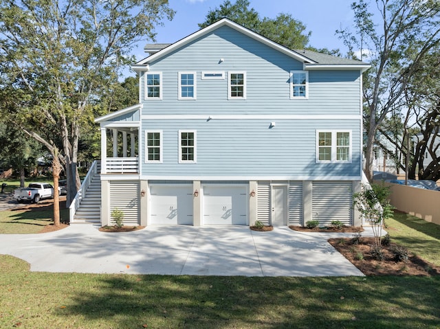 rear view of house with a garage