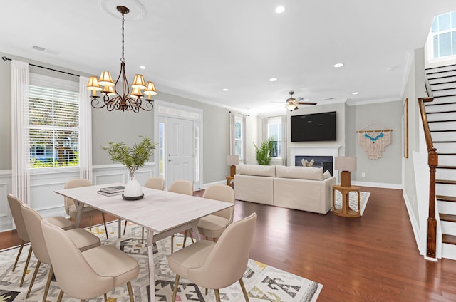 dining area featuring visible vents, stairs, dark wood-style floors, recessed lighting, and ceiling fan with notable chandelier