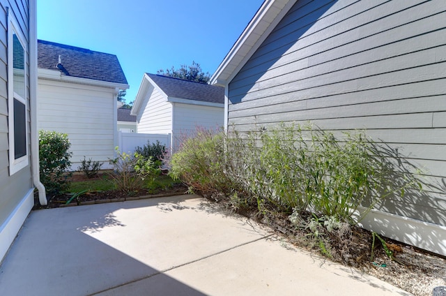 view of patio featuring fence