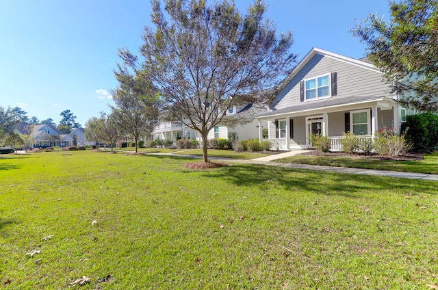 view of front of house featuring covered porch and a front yard