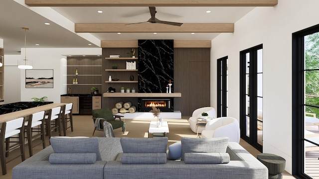 interior space featuring a high end fireplace, beam ceiling, and ceiling fan