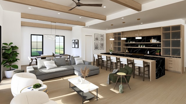 living room featuring beamed ceiling, ceiling fan with notable chandelier, and light hardwood / wood-style flooring