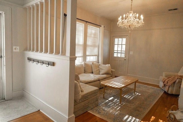 203 Weiters St, Walterboro, SC 29488 - living area featuring a chandelier, wood finished floors, and baseboards