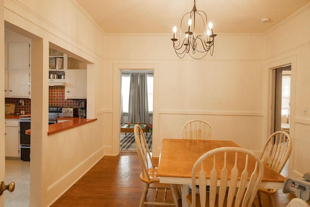 203 Weiters St, Walterboro, SC 29488 - dining area featuring a chandelier, ornamental molding, and wood finished floors