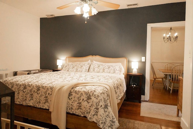 203 Weiters St, Walterboro, SC 29488 - bedroom featuring wood finished floors, a chandelier, and a ceiling fan