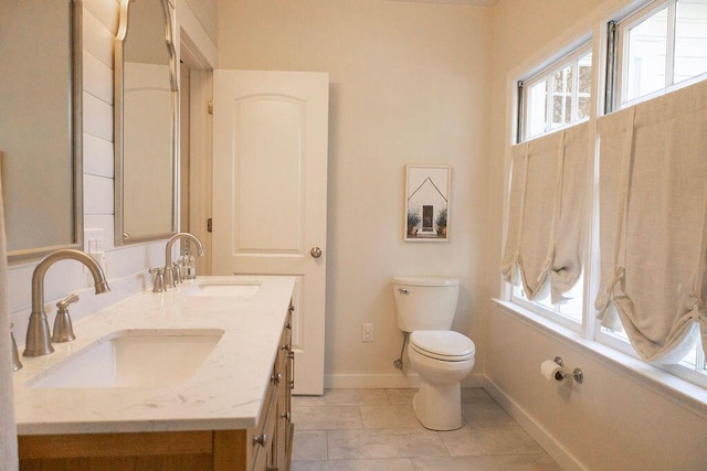 203 Weiters St, Walterboro, SC 29488 - bathroom featuring baseboards, toilet, double vanity, and tile patterned floors