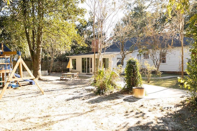 203 Weiters St, Walterboro, SC 29488 - rear view of house with a playground and a patio area