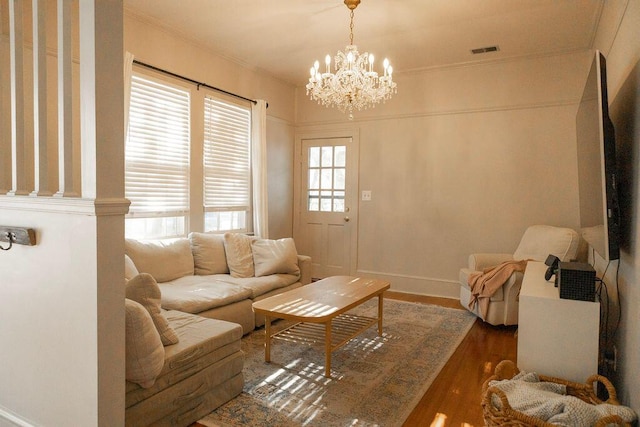 203 Weiters St, Walterboro, SC 29488 - living area with a chandelier, wood finished floors, ornamental molding, and baseboards