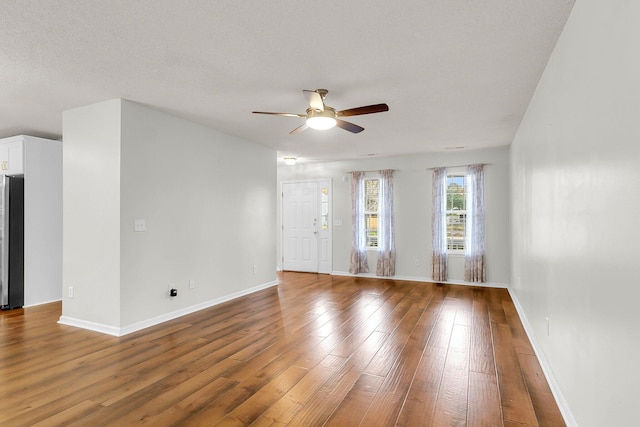 unfurnished room with wood-type flooring and ceiling fan