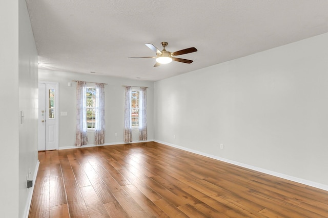 unfurnished room featuring ceiling fan and wood-type flooring