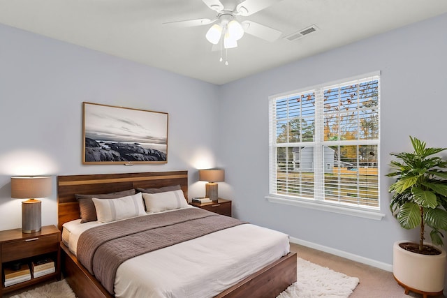 carpeted bedroom featuring ceiling fan