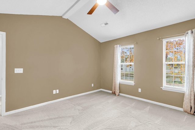 unfurnished room featuring lofted ceiling with beams, light colored carpet, and ceiling fan