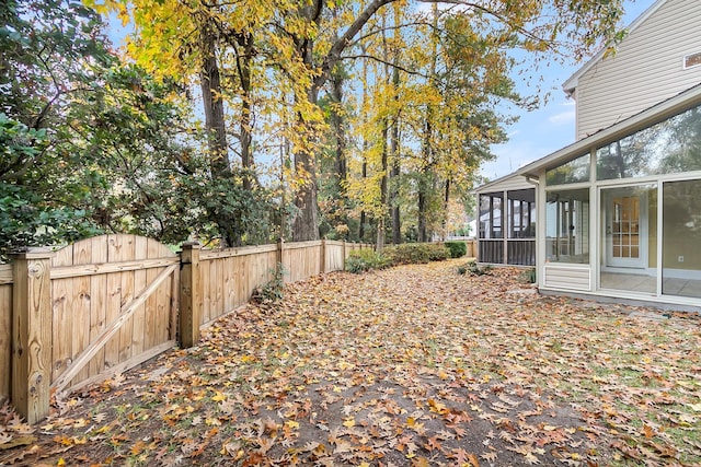 view of yard featuring a sunroom