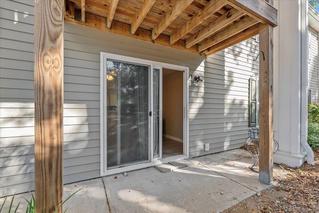 doorway to property with a patio