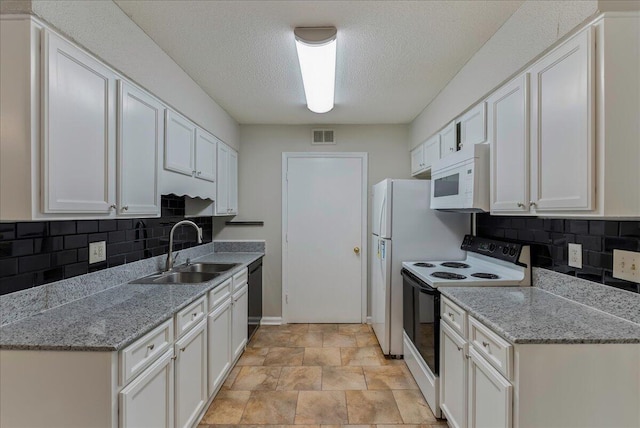 kitchen with white cabinets, white appliances, tasteful backsplash, and sink