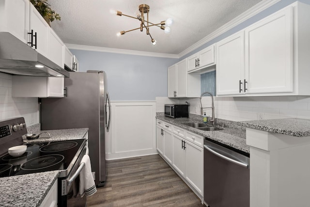 kitchen with sink, crown molding, white cabinetry, stainless steel appliances, and light stone countertops