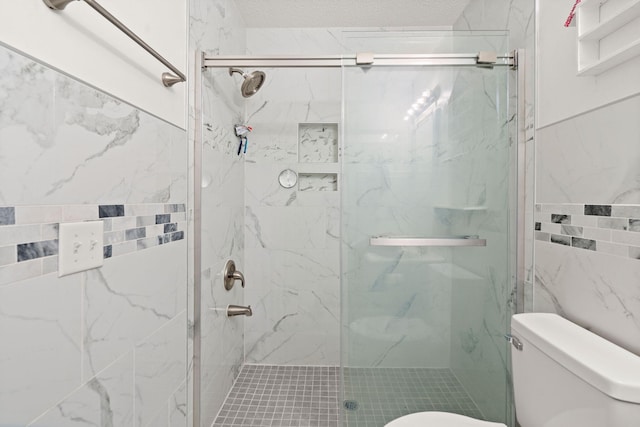 bathroom with walk in shower, tile walls, and toilet