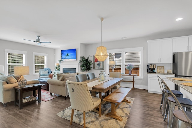 dining room with dark wood-type flooring and ceiling fan