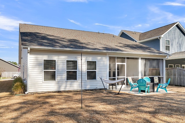 rear view of property featuring a patio area