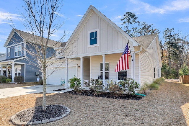 view of front of property with a porch and a garage