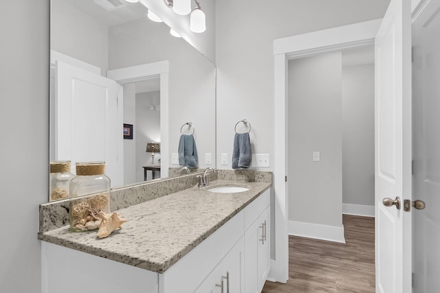 bathroom featuring vanity and hardwood / wood-style floors