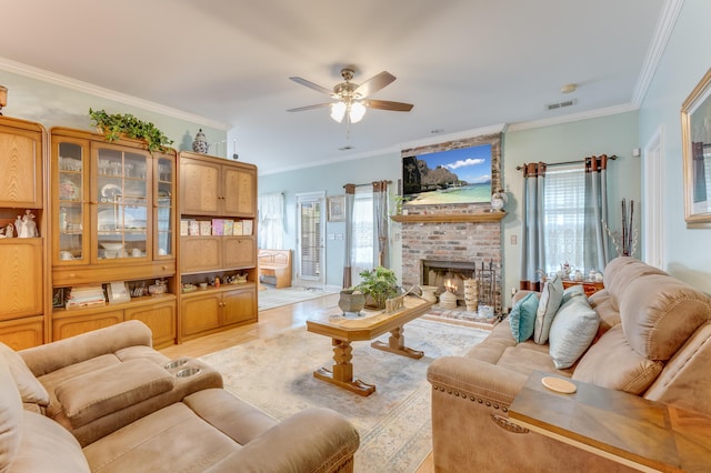 404 Norwood Ct, Moncks Corner, SC 29461 - living area featuring light wood-type flooring, ceiling fan, ornamental molding, and a brick fireplace