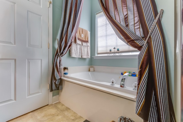 404 Norwood Ct, Moncks Corner, SC 29461 - bathroom featuring a garden tub and tile patterned flooring