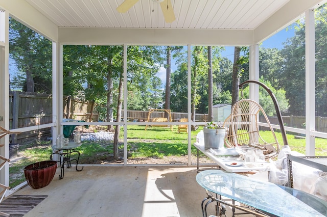 404 Norwood Ct, Moncks Corner, SC 29461 - sunroom / solarium with a ceiling fan, view of wooded area, and plenty of natural light