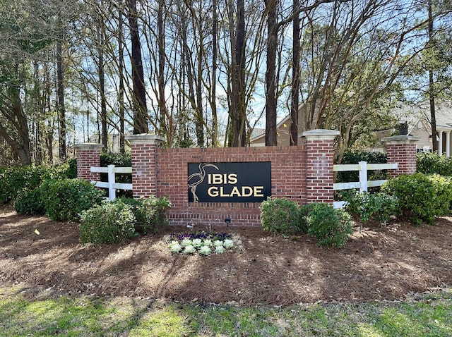 community sign with fence