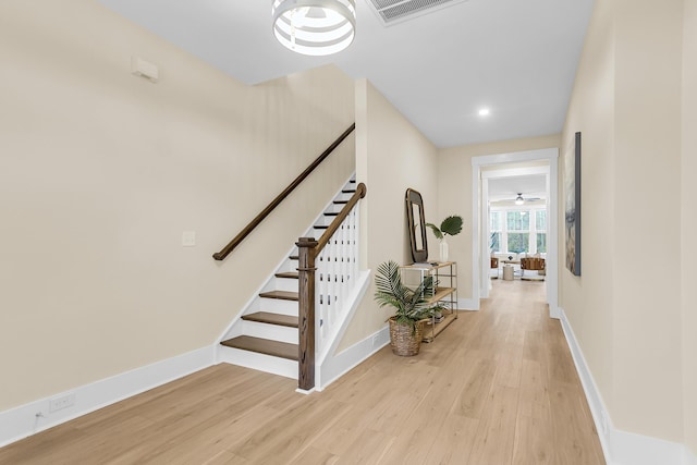 interior space with wood finished floors, visible vents, and baseboards