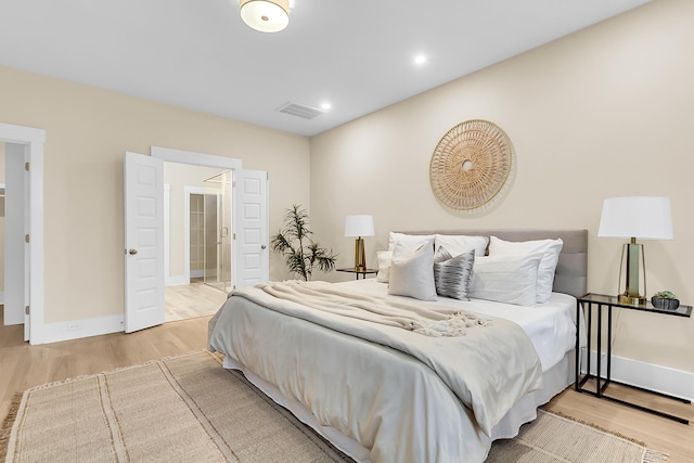 bedroom featuring visible vents, recessed lighting, baseboards, and wood finished floors