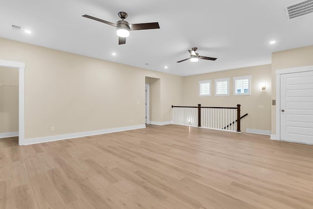 empty room with visible vents, baseboards, ceiling fan, recessed lighting, and light wood-style floors