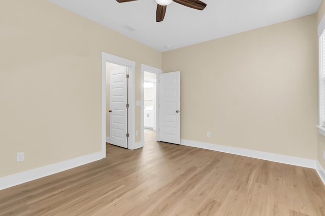 unfurnished bedroom with baseboards, light wood-style flooring, and a ceiling fan