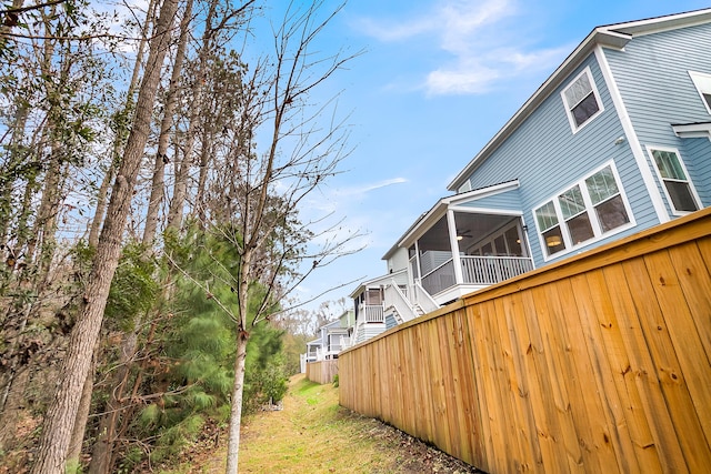 view of side of home with a ceiling fan