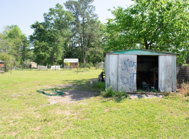 view of shed with fence