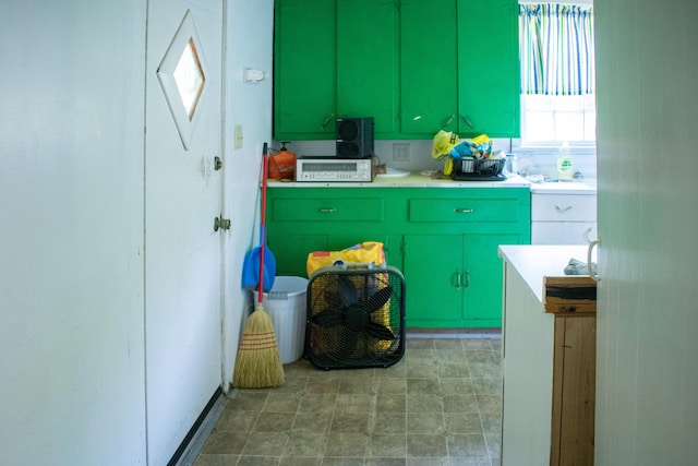 kitchen with light countertops, a healthy amount of sunlight, and green cabinetry