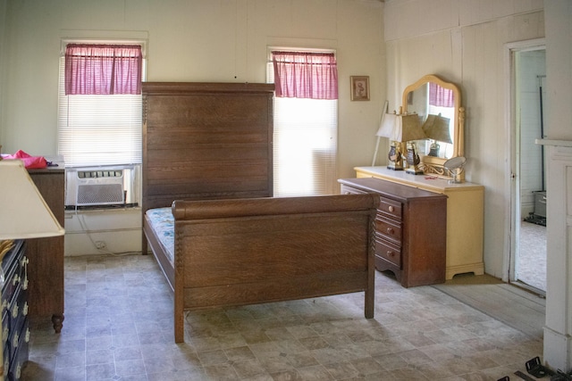 bedroom with light floors and cooling unit
