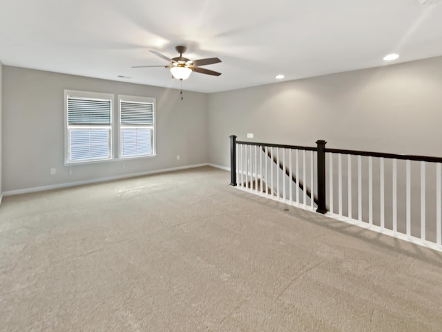 carpeted empty room featuring recessed lighting, ceiling fan, visible vents, and baseboards