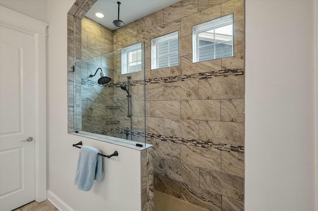 bathroom featuring a tile shower