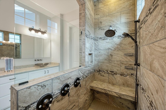 bathroom featuring vanity and a tile shower